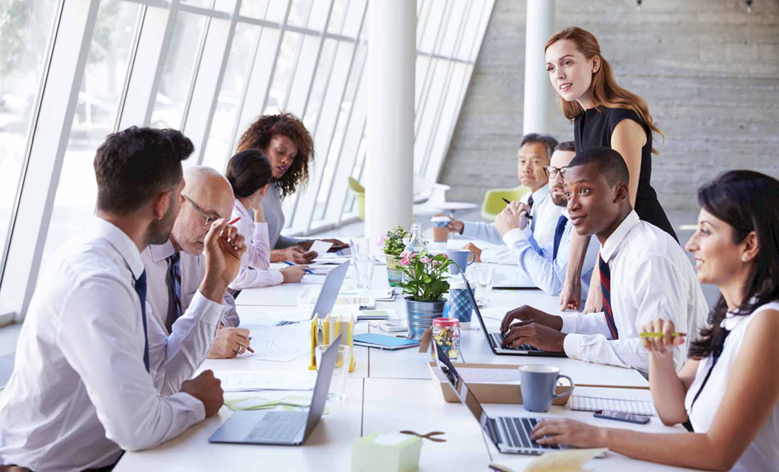 members of the data office meeting around a table