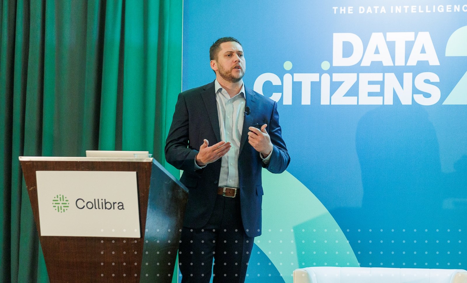 Blog author Kory Cunningham speaking on stage at Data Citizens 22