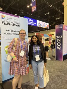 Vidhya Sitaraman, a Senior Software Engineer, and Karina Galinskaya, a Business Intelligence Analyst, stand together at the Grace Hopper Celebration