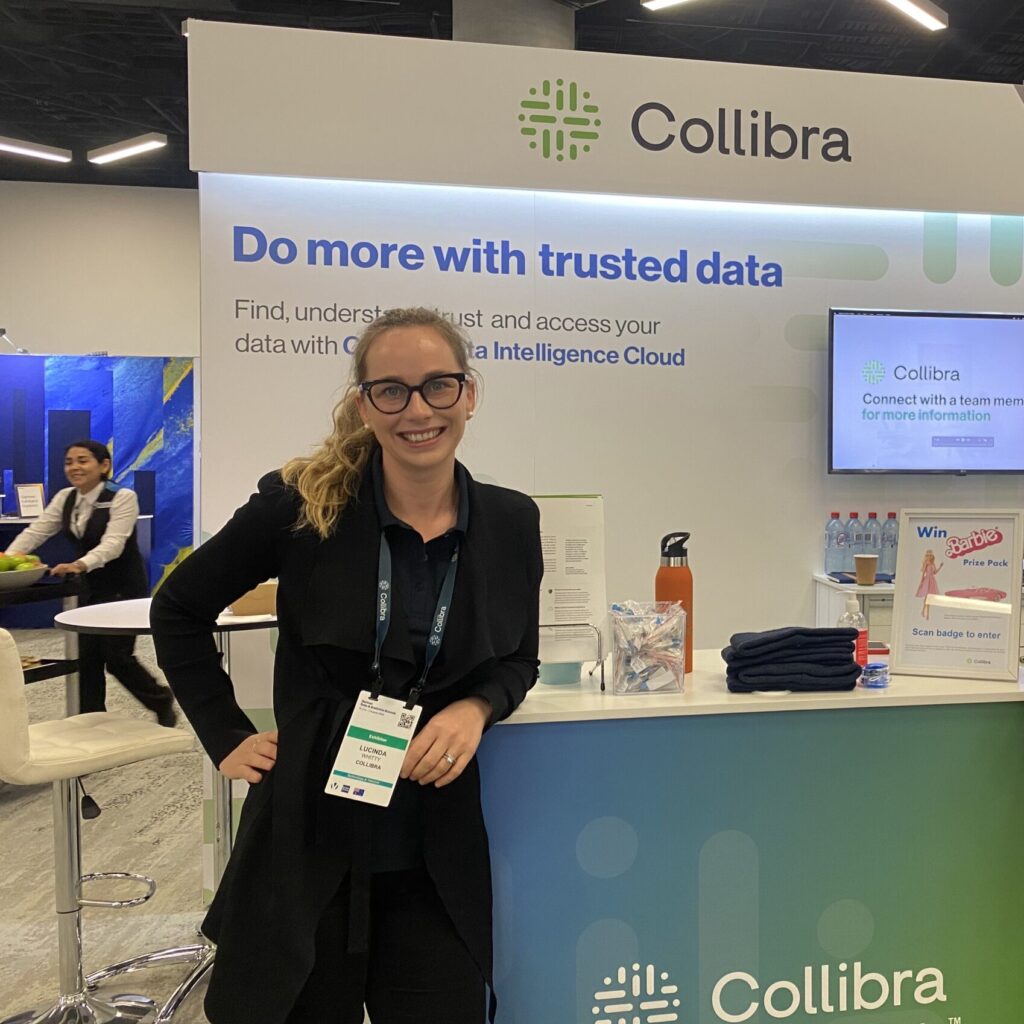 Lucy Whitty and another Collibrian stand at a Collibra-branded event booth