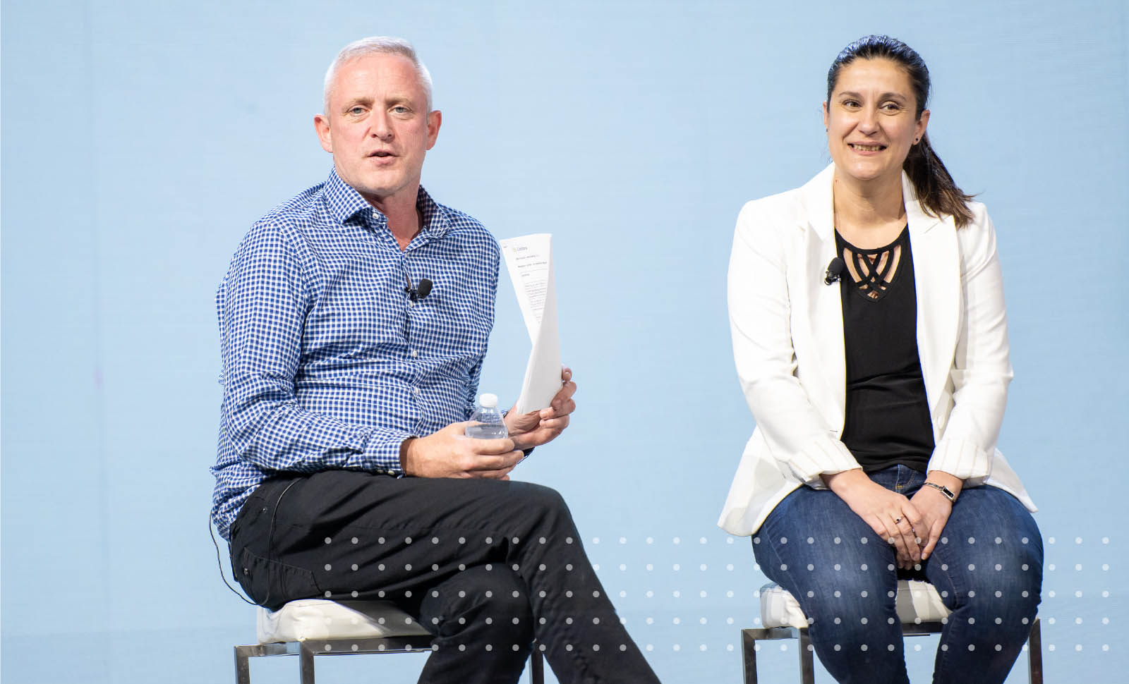 Collibra Chief People Officer Jarlath Doherty and Chief Technology Officer Madalina Tanasie sit on stage talking